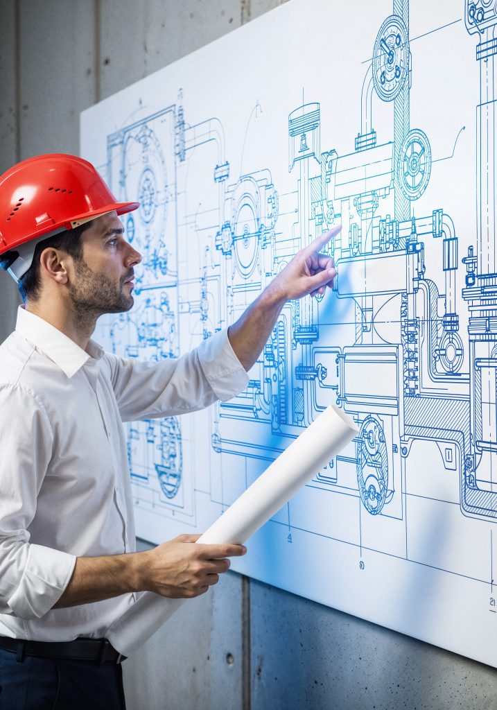 engineer examining blueprint